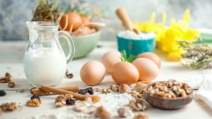 a table with eggs and a glass of milk